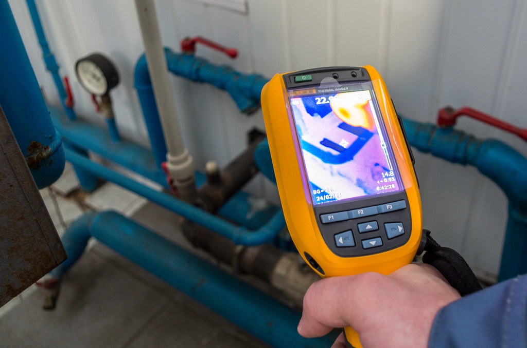 Pressure gauge and detection equipment used to pinpoint plumbing leaks